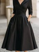 Vestido midi de fiesta con escote en V y cintura marcada