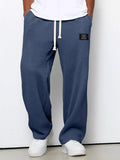 Pantalón ancho de hombre con cordón ajustable y bolsillos