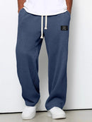 Pantalón ancho de hombre con cordón ajustable y bolsillos