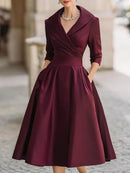 Vestido midi de fiesta con escote en V y cintura marcada