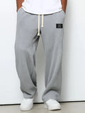 Pantalón ancho de hombre con cordón ajustable y bolsillos