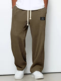 Pantalón ancho de hombre con cordón ajustable y bolsillos