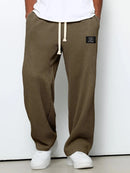Pantalón ancho de hombre con cordón ajustable y bolsillos