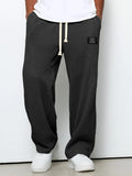 Pantalón ancho de hombre con cordón ajustable y bolsillos