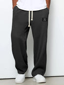 Pantalón ancho de hombre con cordón ajustable y bolsillos