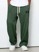Pantalón ancho de hombre con cordón ajustable y bolsillos