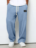 Pantalón ancho de hombre con cordón ajustable y bolsillos