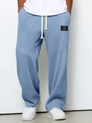 Pantalón ancho de hombre con cordón ajustable y bolsillos