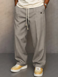 Pantalón ancho de hombre con cordón y pliegues