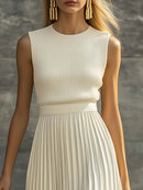 Vestido largo sin mangas con cuerpo de punto y falda plisada