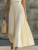 Vestido largo sin mangas con cuerpo de punto y falda plisada